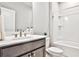 Clean bathroom showcasing a vanity with a modern sink and faucet, plus a shower-tub combination for functionality at 1047 Brandsford Nw St, Atlanta, GA 30318