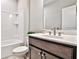 Well-lit bathroom with a modern vanity, sink, and a clean, functional shower-tub combination at 1047 Brandsford Nw St, Atlanta, GA 30318