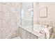 Relaxing bathroom featuring a soaking tub with stylish tile surround and glass partition at 1047 Brandsford Nw St, Atlanta, GA 30318