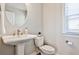 Contemporary half-bathroom with pedestal sink, modern faucet and a large mirror at 1047 Brandsford Nw St, Atlanta, GA 30318