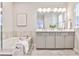 Elegant bathroom with a soaking tub, double vanity, and stylish fixtures for a spa-like feel at 1047 Brandsford Nw St, Atlanta, GA 30318