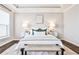 Bright bedroom featuring a tray ceiling, comfortable bed with stylish decor, and neutral tones at 1047 Brandsford Nw St, Atlanta, GA 30318