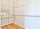 Walk-in closet with wood floor and wire shelving system at 1047 Brandsford Nw St, Atlanta, GA 30318