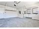 Spacious two-car garage with ample storage options and electric car charger showing functionality and utility at 1047 Brandsford Nw St, Atlanta, GA 30318