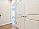 Hallway view of a bedroom through the door and a storage area in the foreground showing the house's design at 1047 Brandsford Nw St, Atlanta, GA 30318
