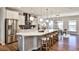 Kitchen and dining area showcasing quartz countertops, stainless appliances, and hardwood floors at 1047 Brandsford Nw St, Atlanta, GA 30318