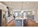 Open-concept kitchen featuring stainless appliances and a large central island at 1047 Brandsford Nw St, Atlanta, GA 30318