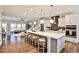 Bright, open kitchen featuring a large island, stainless steel appliances and hardwood floors at 1047 Brandsford Nw St, Atlanta, GA 30318