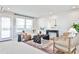 Bright and airy living room with a neutral color palette, modern decor, and large window at 1047 Brandsford Nw St, Atlanta, GA 30318