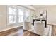 Inviting living area with wood floors, large windows, and elegant decor for a comfortable and stylish space at 1047 Brandsford Nw St, Atlanta, GA 30318