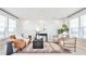 Bright and inviting living room with shiplap wall, stylish decor and a large window at 1047 Brandsford Nw St, Atlanta, GA 30318