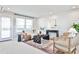 Cozy living room featuring shiplap accent wall, modern furniture and abundant natural light at 1047 Brandsford Nw St, Atlanta, GA 30318