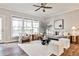 Bright living room features contemporary decor, hardwood floors, and multiple windows at 1047 Brandsford Nw St, Atlanta, GA 30318