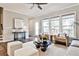 Inviting living room with large windows, stylish seating, and neutral decor throughout at 1047 Brandsford Nw St, Atlanta, GA 30318