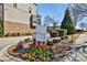 Welcome to the community, beautifully landscaped with colorful flowers and a sign indicating a Smart Neighborhood at 1047 Brandsford Nw St, Atlanta, GA 30318