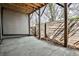 Spacious covered patio with concrete flooring and wooden support beams, perfect for outdoor relaxation at 1047 Brandsford Nw St, Atlanta, GA 30318