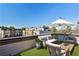 Relax on the cozy patio featuring modern furniture, an umbrella, and community views at 1047 Brandsford Nw St, Atlanta, GA 30318