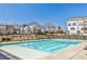 Enjoy a refreshing swim in the community pool, surrounded by modern townhomes under a clear sky at 1047 Brandsford Nw St, Atlanta, GA 30318