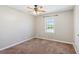 Bedroom featuring a ceiling fan and a window at 1604 Quail Sw Run, Conyers, GA 30094