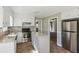 Well-lit kitchen features stainless steel appliances, an island, and tile flooring at 1604 Quail Sw Run, Conyers, GA 30094