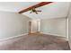 Bright living room with neutral walls and trim, carpeted flooring and access to the hallway at 1604 Quail Sw Run, Conyers, GA 30094