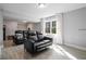 Comfortable living area with black leather recliners and a window provides a relaxing space for entertainment at 3775 Lake Seminole Dr, Buford, GA 30519