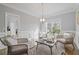 Cozy sitting area featuring neutral colors, hardwood floors, and ample natural light at 3775 Lake Seminole Dr, Buford, GA 30519