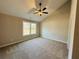 Neutral bedroom with carpet, a ceiling fan, and natural light from the window at 488 West Ave, Bowdon, GA 30108