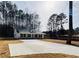 New construction home featuring a modern color scheme and long concrete driveway at 488 West Ave, Bowdon, GA 30108