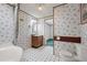 Bathroom features a tub/shower combination, patterned wallpaper, and tile flooring at 718 Old Tennessee Ne Hwy, White, GA 30184