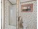 The bathroom includes a glass enclosed shower, toilet, and patterned wallpaper at 718 Old Tennessee Ne Hwy, White, GA 30184