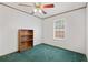 Bedroom showcasing green carpeting, a window, and built-in shelving at 718 Old Tennessee Ne Hwy, White, GA 30184