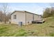 Exterior view shows the side of the home with siding and a small porch at 718 Old Tennessee Ne Hwy, White, GA 30184