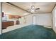 Living room showing carpet, vinyl floors, a ceiling fan, and neutral wall colors at 718 Old Tennessee Ne Hwy, White, GA 30184