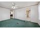 Bedroom showing carpet, ceiling fan, neutral wall colors, and a doorway to the bathroom at 718 Old Tennessee Ne Hwy, White, GA 30184