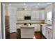 Well-lit kitchen with white cabinets, stainless steel appliances, and granite countertops, providing a functional layout at 826 Bexley Park Way, Mableton, GA 30126