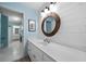 Bright bathroom featuring a wood-framed mirror, white shiplap wall, and modern sink with white cabinetry at 2883 Observation Nw Pt, Marietta, GA 30064