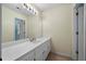 Bathroom with large mirror above a white vanity and access to another room at 2883 Observation Nw Pt, Marietta, GA 30064