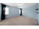 Spacious bedroom with two windows, carpet flooring and light blue painted walls at 2883 Observation Nw Pt, Marietta, GA 30064