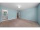 Large bedroom with light blue walls, neutral carpet, and an en-suite bath at 2883 Observation Nw Pt, Marietta, GA 30064