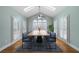 Dining room with a large table, vaulted ceiling, skylights, and lots of natural light at 2883 Observation Nw Pt, Marietta, GA 30064