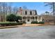 Charming home features a covered porch, dormer windows, and lush landscaping, creating inviting curb appeal at 2883 Observation Nw Pt, Marietta, GA 30064