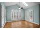 Bright living room featuring vaulted ceiling, skylight, and large windows with wooden floors at 2883 Observation Nw Pt, Marietta, GA 30064
