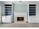 Cozy living room featuring a fireplace with built-in shelving on either side at 2883 Observation Nw Pt, Marietta, GA 30064
