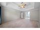Spacious main bedroom featuring a tray ceiling, carpet, and ample natural light at 2883 Observation Nw Pt, Marietta, GA 30064