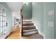 Inviting staircase with carpeted steps and wood railing, leading to the upper level of the home at 2883 Observation Nw Pt, Marietta, GA 30064