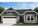 Charming single-story home featuring stone accents, a two-car garage, and a beautifully landscaped front yard at 33 Parkdale Ct, Dallas, GA 30157