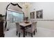 Formal dining room featuring a stylish chandelier, neutral color palette, and elegant window treatment at 4030 Crescent Walk Ne Ln, Suwanee, GA 30024