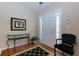 Inviting foyer with hardwood floors, decorative console table, and elegant decor at 4030 Crescent Walk Ne Ln, Suwanee, GA 30024