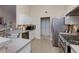 Well-lit kitchen featuring stainless steel appliances, ample counter space, and tile backsplash detailing at 4030 Crescent Walk Ne Ln, Suwanee, GA 30024